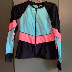 New without tags. Never worn rashguard swim top